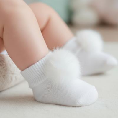 LD5037-W  White Pom Pom Socks  (0-6 months)