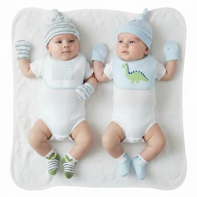 NT25-1358  8 Piece "Dino" Bib, Hat, Mitts and Socks Set  (0-3m)
