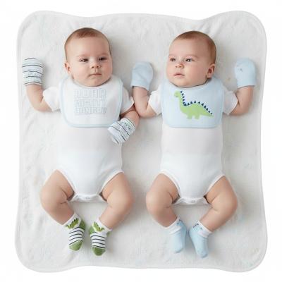 NT25-1358  8 Piece "Dino" Bib, Hat, Mitts and Socks Set  (0-3m)