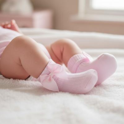 STS123-P-0-6  Pink Ribbed With Bow Sock  (0-6 months)