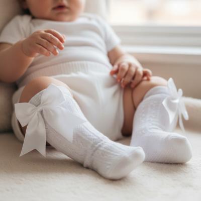 STS350-W-06  Elegance White Bow Sock  (0-6 months)