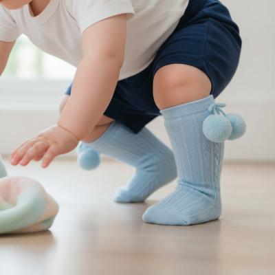 STS355-B-0-6   Elegance Sky Blue  Pom pom Sock  (0-6 months)