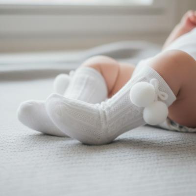 STS355-W-6-12  Elegance White Pom pom Sock  (6-12 months)