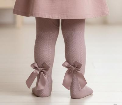 STT120-DP  Dusky Pink Jaquard Tights with Long Bow  (NB to 24m)